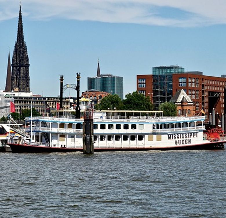 cargo ship named Mississippi Queen on river